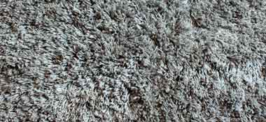 close up of grey carpet fibers