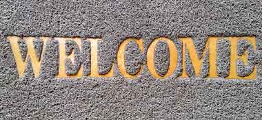 plastic doormat to protect carpet with the word welcome 1